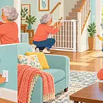 Grandparent securing medicines, fitting a stair gate and covering an outlet before a toddler arrives