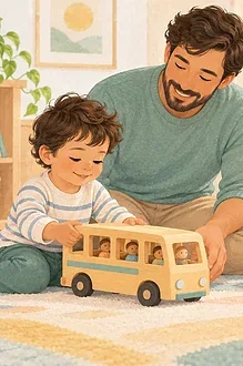 Father supporting two children playing with a toy bus and blocks